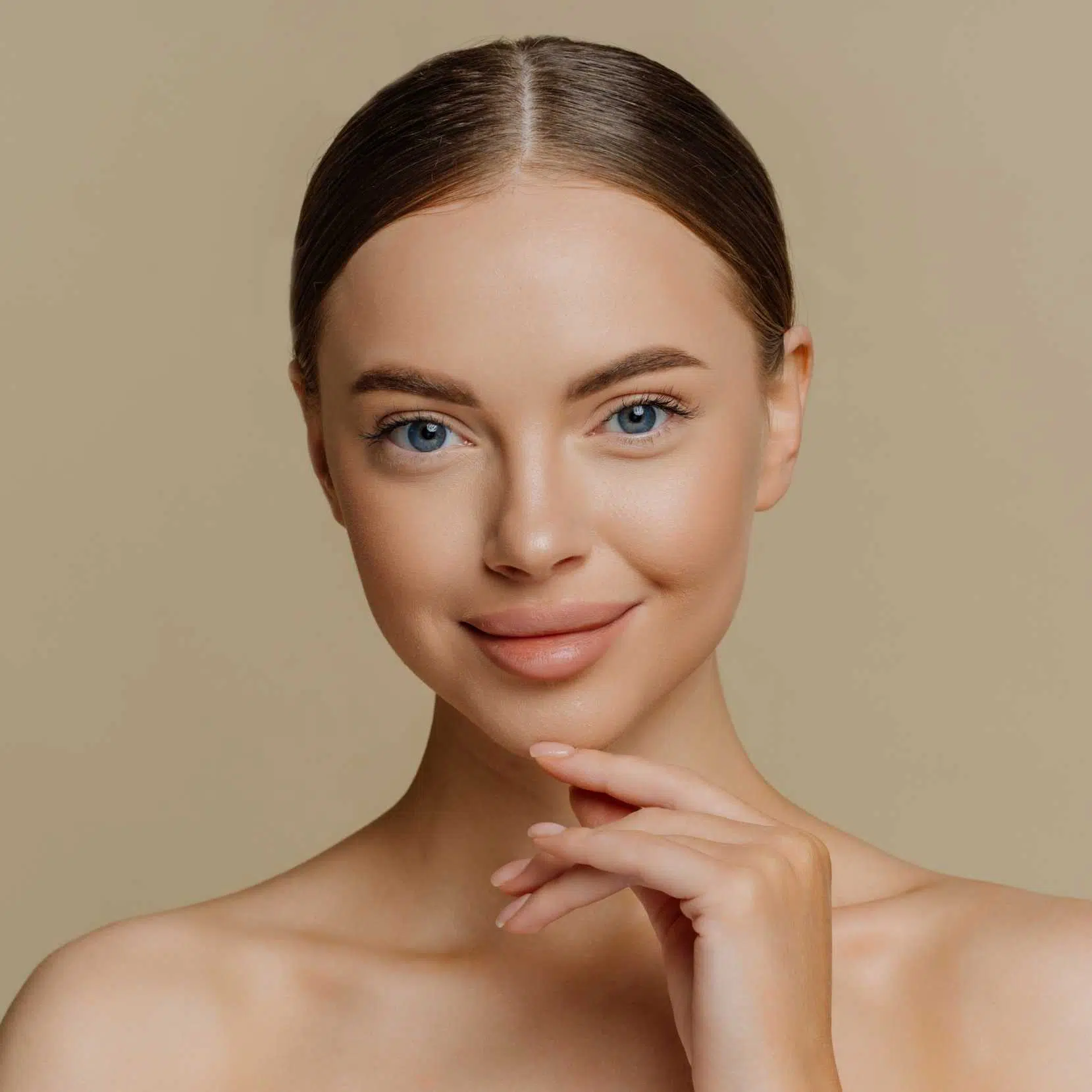 Portrait of a woman with natural glowing skin representing the health-first approach to aesthetic excellence at Memorial Care